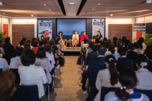 A panel of women being watched by an audience at the UK Pavilion in World Expo 2025 Osaka